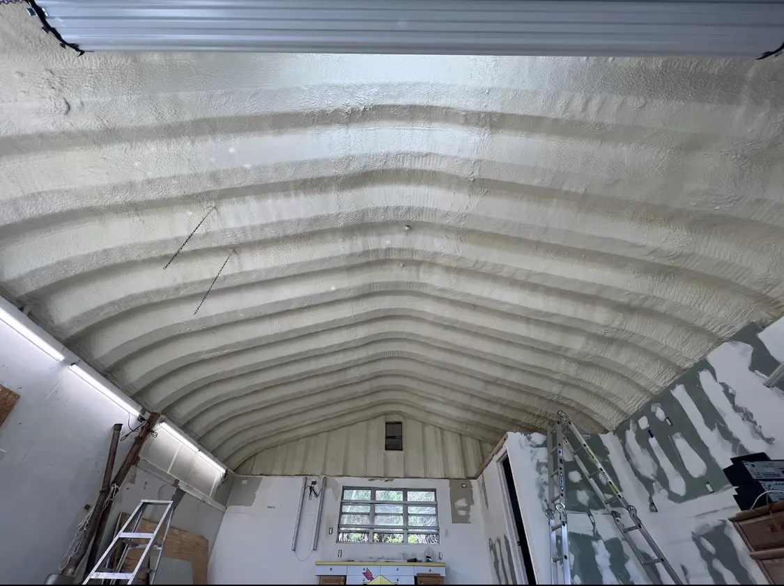 Spray polyurethane foam applied to the underside of a metal roof deck in Conshohocken